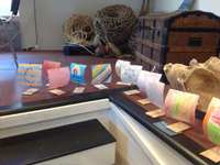 A fleet of colourful sailing boats made by children under the instruction of Margaret Taylor-Hill.